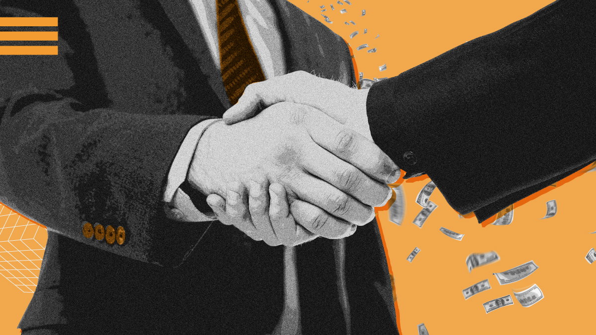 Homem de terno e gravata dando a mão para outro - Startups